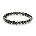 Detailed view of polished black hematite beads with high metallic luster on a single bracelet - Hematite