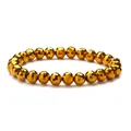 Sparkling 8mm faceted gold crystal bead bracelet with geometric multi-cut surfaces - Gold
