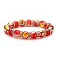Kristallperlen-Armband in Rot und Gelb mit vergoldeten Strass-Zwischenstücken auf Weiß - 10mm Rot