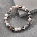Rosa Zebra-Jaspis Perlenarmband mit roségoldener Krone und Naturstein-Perlen - Mattierte Ausführung / Roségold Krone/Rosa Zebra