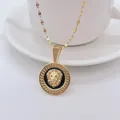 Goldene Halskette mit Löwenkopf Anhänger und grünen Zirkonia Augen auf schwarzer Emaille - Gold / Lippenkette