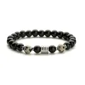 Pulsera de cuentas de obsidiana negra y jaspe dálmata con cuenta de metal plateado texturizado - Piedra Manchada