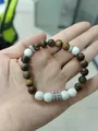 Blue tiger eye and volcanic stone beaded bracelet with stainless steel accents - Matte Tiger Eye