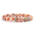 Agate bead bracelet with rose gold micro-set crown charm on white background - Red Network Stone