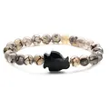 Natural agate beaded bracelet featuring a dark blue penguin sandstone charm on white backdrop - Blue Sandstone Dragon Vein Agate Penguin