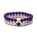 Lava stone couple bracelets set featuring contrasting purple and white beads - Purple