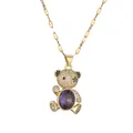 Golden necklace with micro-paved bear pendant featuring a large oval purple crystal - Purple