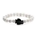Minimalist beaded bracelet featuring white round stones and a black sandstone penguin bead - Blue Sandstone Porcelain White Penguin
