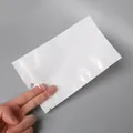 Sachet blanc perlé à fermeture zip pour bijoux avec trou de suspension rond - 12x20cm (50 Pièces/Paquet)
