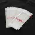 Transparent self-adhesive lipstick bags with red bows and Hand Made print design - 100 Pieces/Pack (5x10+3cm) / Bow