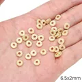 Golden frosted flat round spacer beads in 6.5x2mm size held in hand for jewelry making - Center Hole Disc (FGT674) / 1 Piece / Gold