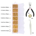 DIY jewelry kit with gold open jump rings in a storage box with pliers and tweezers - Jump Rings And Pliers And Tweezers And Ring Opener / Gold