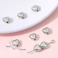 Cuentas espaciadoras de corazón plata antigua para creación de joyas DIY de 7mm - Corazón / Pack de 30