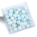 Blue and white gradient glass beads for DIY necklaces shown in a clear plastic box - 8mm (50pcs/Pack) / Light Blue