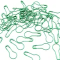 Primer plano de imperdibles con forma de calabaza verde brillante para tejer DIY - 100 Piezas / Verde