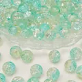 Mint green crackle glass beads for DIY jewelry making displayed on a small glass dish - Diameter 8mm (50pcs/Strand) / Yellow Green