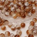 Perle tonde in vetro craquelé nei toni dell'ambra per la creazione di gioielli fai da te - Diametro 10mm, foro circa 1,5mm, 10 pezzi/confezione / Marrone chiaro