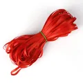 Roll of bright red satin ribbon with smooth finish and silky sheen for DIY handmade crafts - Red