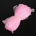 Rouleau de ruban en mousseline rose pour DIY avec texture semi-transparente et éclat subtil - Rose