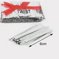 Silver 6cm metallic twist ties for gift packaging and DIY crafts in a clear plastic bag - 4mm x 6cm / Silver