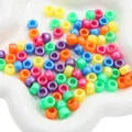 Colorful mix of acrylic pony beads in a white bowl for DIY jewelry and hair crafts - Pearlescent Barrel Beads (#05)