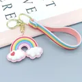 Close-up of rainbow cloud keychain with soft silicone strap and gold lobster clasp - Soft Glue Cord Series