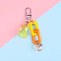 Detail of colorful resin bear keychain with acrylic chain and iridescent heart pendant - Orange and Yellow Theme Style (a5040-5)