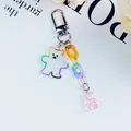 Detail of glitter acrylic bear keychain with colorful plastic links and a metal lobster clasp - Colorful