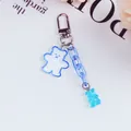 Blue translucent acrylic bear keychain with glitter details and silver clasp for bags - Blue