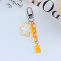 Detail of jelly bear keychain with glitter acrylic pendant and orange link chain strap - Orange