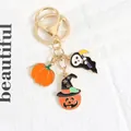 Dettaglio portachiavi di Halloween con ciondoli a forma di zucca, mietitore e cappello da strega - Stile Doppia Zucca Morte (a5082-1)