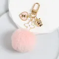 Detail of pink fluffy pom-pom keychain with gold bear charm and white flower pendant - Pink Bear Style (a5023-2)
