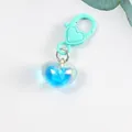 Close-up of translucent blue heart pendant with mint green lobster clasp on white background - Mint Green