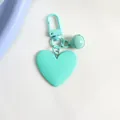 Detailed view of mint green heart-shaped keychain with matching bell and matte finish - Mint Green (a5098-4)