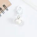 Close-up of heart-shaped keychain with iridescent acrylic pendant and white lobster clasp - White