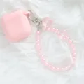 Detail of pink crystal flower keychain on soft white fur for bags or AirPods cases - Iridescent Pink (5144-5)