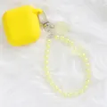 Close-up of bright yellow silicone earphone case with crystal flower beaded keychain - Bright Yellow (5144-4)