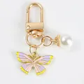 Pastel butterfly charm keychain with white pearl pendant and golden lobster clasp - Pink Purple Yellow Butterfly (5111-1)