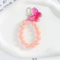 Dettaglio macro del ciondolo farfalla sfumata con perline rosa e chiusura argento - Sfumato Rosa-Viola (5164-4)