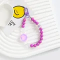 Close-up of purple acrylic heart beads and metal spring clasp on a white plate - Purple (5167-5)