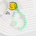 Detail of mint green acrylic beaded phone charm with pink heart pendant and metal clasp - Mint Green (5167-3)