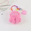 Macro detail of pink plush monster keychain with LOVE beads and a pink heart charm - Pink