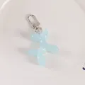 Close-up of a light blue jelly balloon dog keychain with silver metal lobster clasp - Light Blue