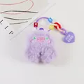 Close-up of purple plush monster charm with letter beads and a heart for ever pendant - Purple