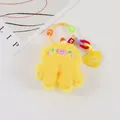 Detail of yellow plush monster keychain with letter beads and a heart charm - Yellow