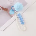Detail of blue plush pompom keychain with pearl chain and heart-shaped for ever tag - Light Blue (8196-4)
