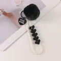 Detail of black faux fur pompom keychain with white pearl beads and heart charms - Black (8196-3)