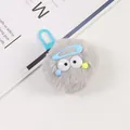 Macro shot of a grey plush monster keychain with blue clasp on a clean background - Gray