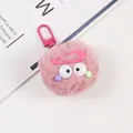 Detail of a pink fuzzy monster keychain with big eyes and metal clip on a white backdrop - Dusky Pink