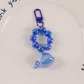 Iridescent blue resin whale keychain with colorful beads and a blue metal D-ring clasp - Iridescent Blue-Purple (yc-5193-1)